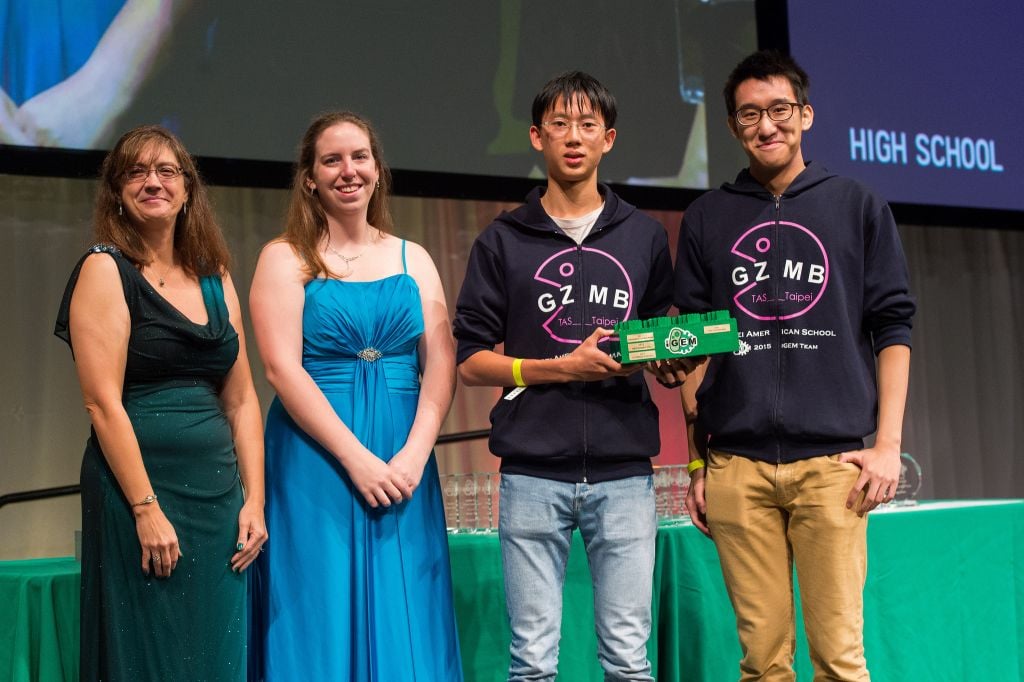 Two members of the TAS Teipei High School team accepting the grand prize for their Genzyme Project (Credit: iGEM Foundation & Justin Knight)