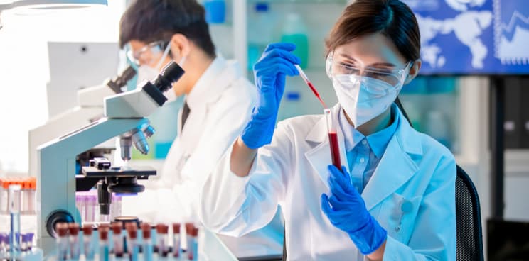 woman in laboratory, microscope, vaccine development